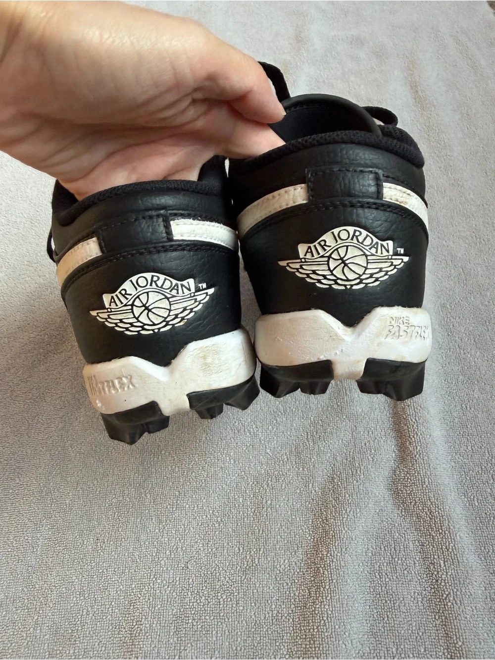 Nike Kids Black and White Baseball Cleats with Swoosh